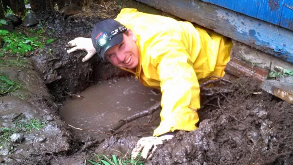 plumber in mud working at job site clarksville tn